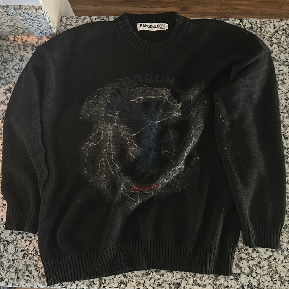 BANGOULUO is the brand. It’s a thick, heavy, black sweater, Size XL